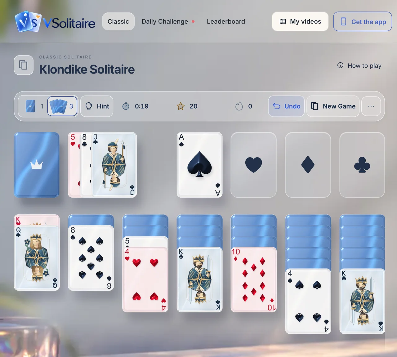 A Klondike game on desktop in the light theme, with the Draw 1 or 3 choice, Hint, Undo and New Game above the cards.